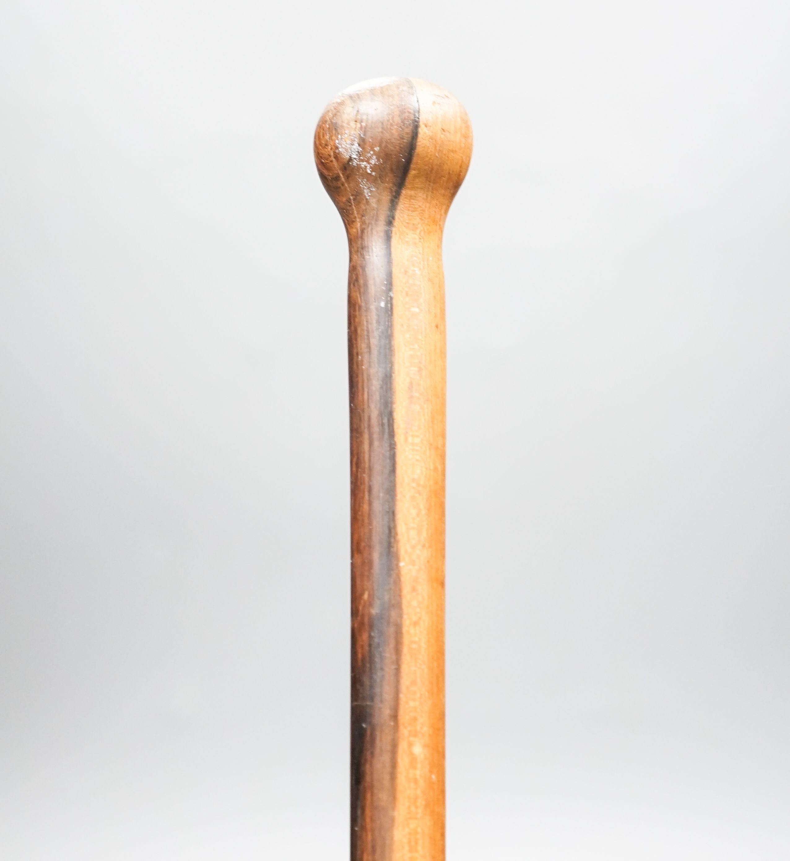 An ebony walking cane